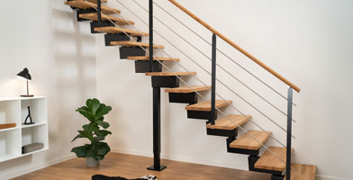 Straight flight staircase in black with oak treads and handrail