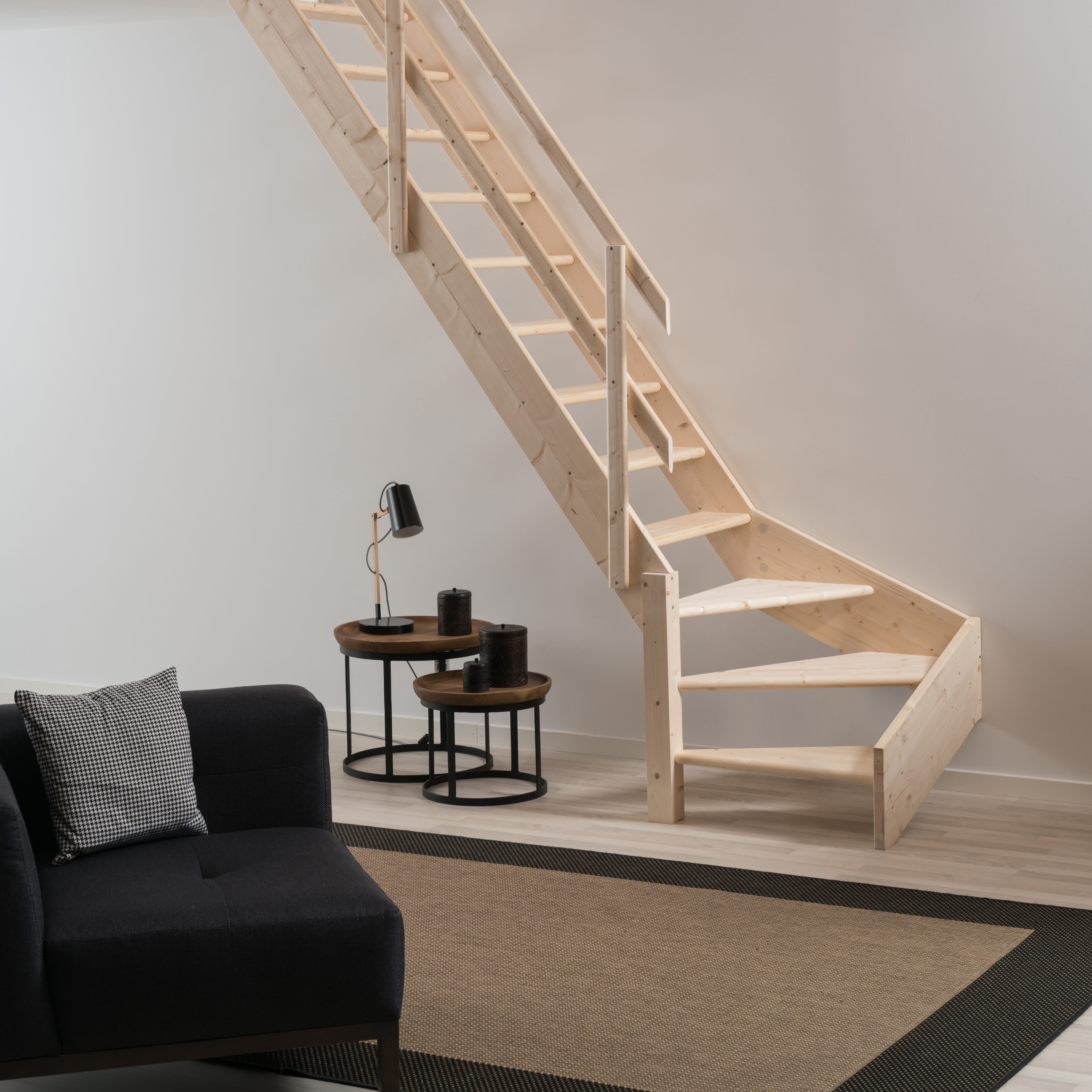 wooden loft stair in spruce with handrail carpet in front