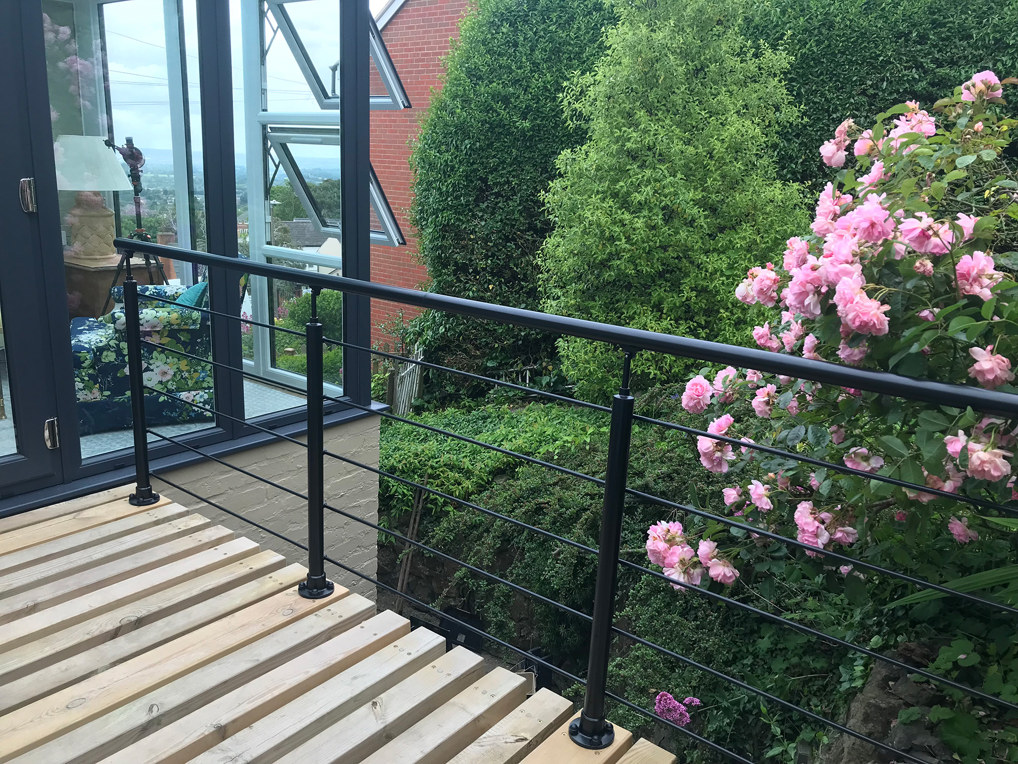 Upstairs conservatory extension with a stylish, safe guard