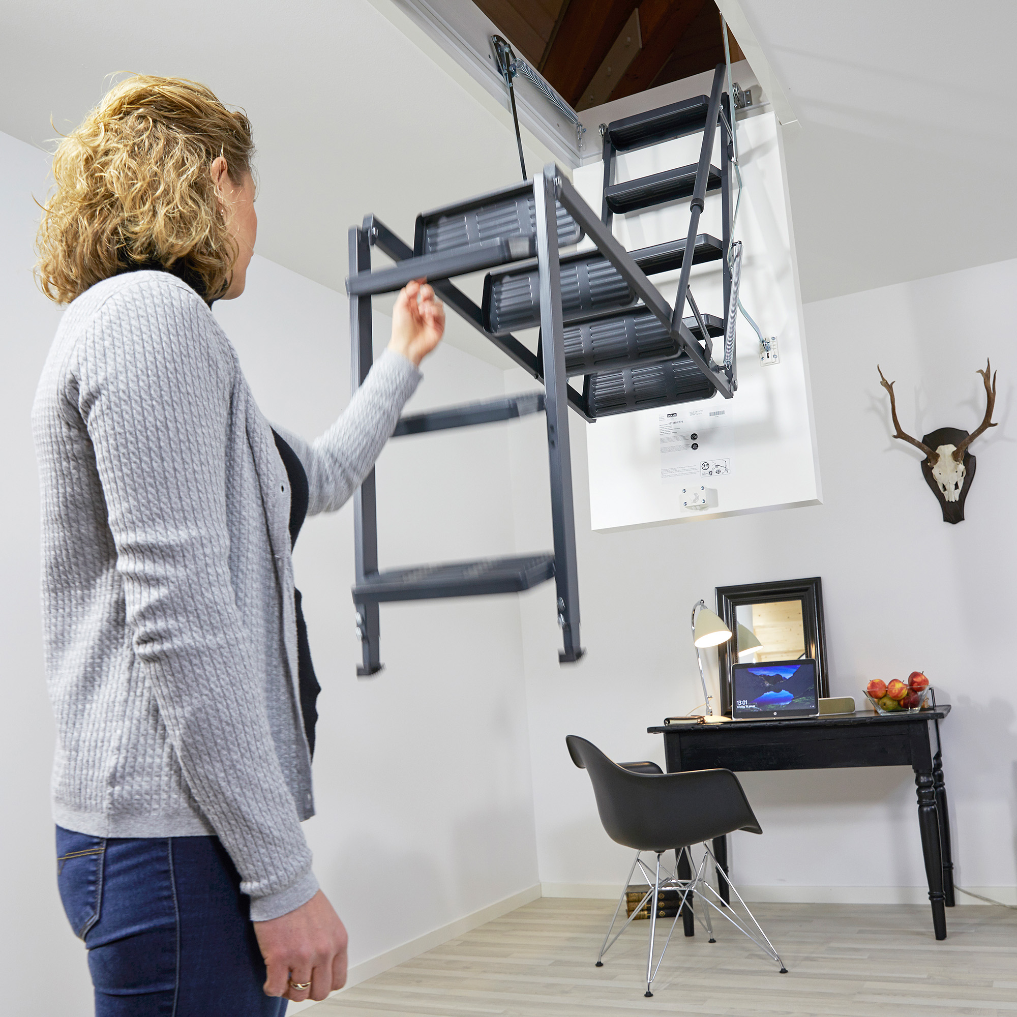 Women showing easy use of a loft ladder